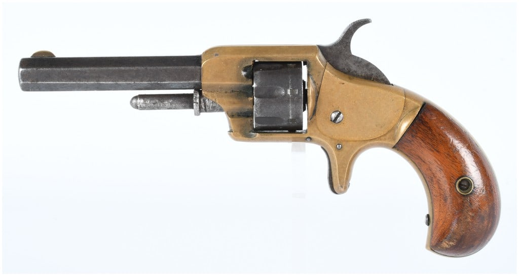 Antique Whitneyville Armory Model No. 1 .22 RF Spur Trigger Revolver: An antique Whitneyville Armory Model No. 1 .22 RF Spur Trigger Revolver. This compact, antique-style revolver features a brass frame, a dark patinated octagonal steel barrel, and a five-shot fluted st