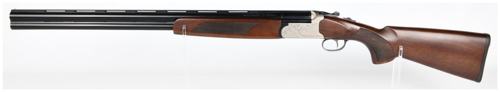 Mossberg International Silver Reserve II 12 GA Over/Under Shotgun with 28" Barrel: A Mossberg International Silver Reserve II 12 GA over/under shotgun, featuring a 28" barrel. It features blued steel barrels, a dark brown wooden stock and forend with checkered grip panels, and a sil