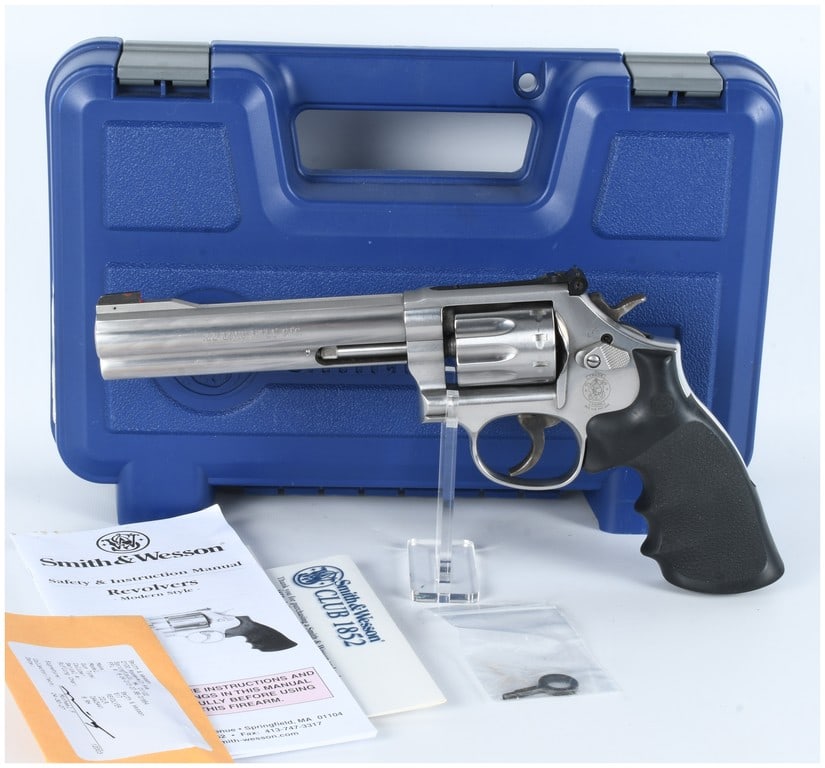 Smith & Wesson Model 617-6 .22 LR 10-Shot Stainless DA Revolver with Case and Accessories: A Smith & Wesson Model 617-6 .22 LR 10-Shot Stainless Double Action Revolver. This modern-style handgun is constructed primarily of stainless steel with a matte finish and features black rubberized gr