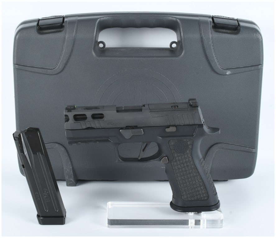 SIG SAUER P320 AXG Pro Spectre Comp Semi-Automatic Pistol: A modern black finish polymer and steel semi-automatic pistol, identified as a SIG SAUER P320 AXG Pro Spectre Comp. The slide is marked "SIG SAUER" and "P320," with "AGENCY" visible on the barrel. The