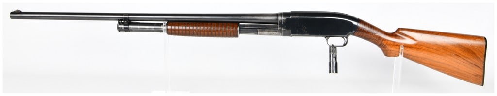 Win Model 12 Pump-Action Shotgun 12 Gauge 28" Barrel: A vintage Winchester Model 12 pump-action shotgun, featuring a 28" barrel and coming with one modified choke and one unknown. Constructed with a blued nickel steel barrel and receiver, complemented by