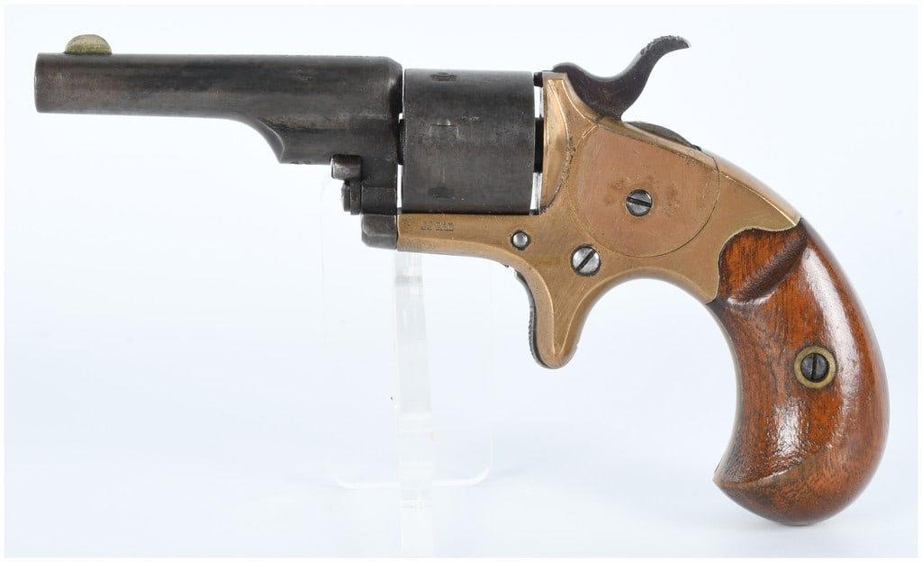 Colt House Model Open Top Spur Trigger Revolver .22 Cal: An antique Colt House Model Open Top Spur Trigger Revolver, likely dating from the mid-to-late 19th century. This compact firearm is chambered in .22 caliber, as indicated by the "22 CAL" stamp on the
