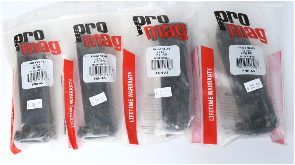 A Group of Four ProMag FNH-A5 15-Round Magazines for FNX-45 .45 ACP: A collection of four new, sealed ProMag aftermarket magazines designed for the FNH-FNX-45 semi-automatic pistol. These magazines are constructed of Blue Steel and are designed to hold 15 rounds of .45