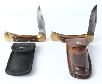 A Pair of Vintage Folding Lockback Pocket Knives with Sheaths Buck and Schrade Old Timer