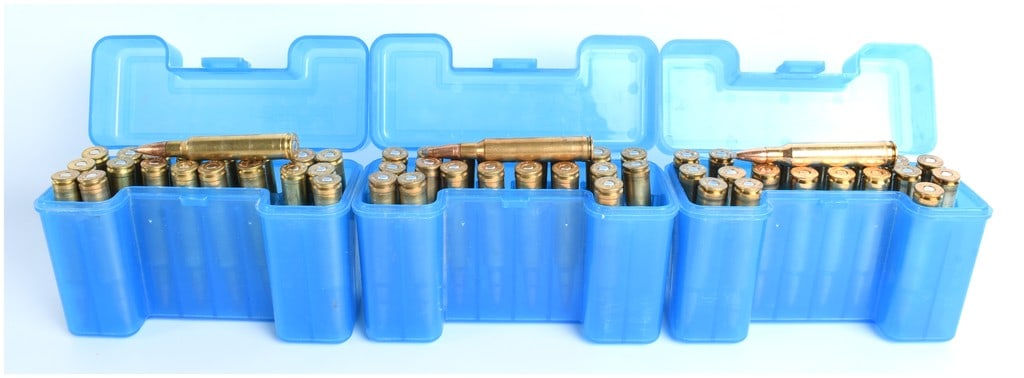 A Lot of 60 Rounds of .308 Norma Magnum Ammunition: A lot of 60 rounds of .308 Norma Magnum ammunition stored in three blue polymer storage boxes. The ammunition features brass casings and copper-jacketed projectiles, consistent with high-performance r