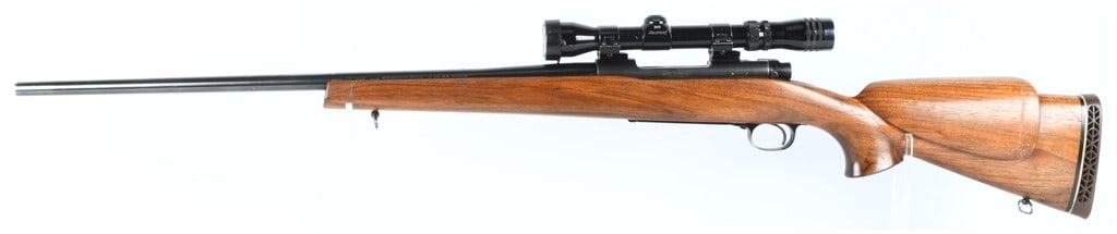 Winchester Model 70 Bolt Action Rifle .300 Win. Magnum: A single Winchester Model 70 bolt-action rifle chambered in .300 Winchester Magnum, featuring a high-gloss blued finish. The receiver is marked with the serial number 798228. The barrel is marked: -WI