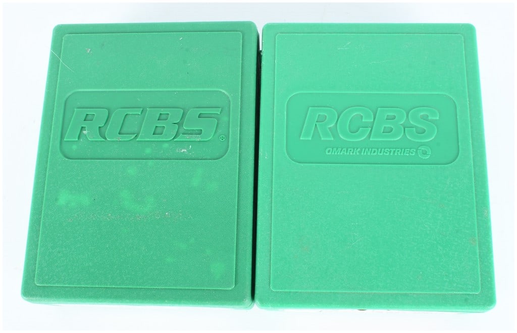 RCBS Reloading Die Sets for .45 Colt and .300 Weatherby Magnum: This lot consists of two complete RCBS reloading die sets, each housed in its original green polymer storage case. RCBS is a well-regarded manufacturer of reloading equipment, often marked under OMARK