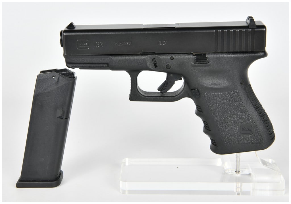 Glock Model 32 Semi-Automatic Pistol, .357 SIG, Serial Number FRY833: A Glock Model 32 semi-automatic pistol chambered in .357 SIG. The handgun features a black polymer frame with ergonomic finger grooves and a textured grip surface. The slide is finished in a durable