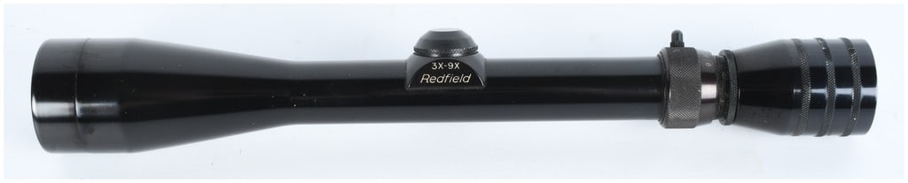 Redfield 3X-9X Variable Power Riflescope: A vintage Redfield variable-power riflescope, clearly marked "3X-9X Redfield" on the adjustment housing. This model is consistent with US-made Redfield hunting scopes produced during the mid-to-late 2