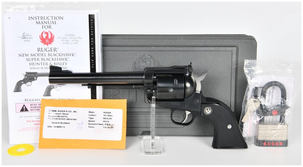 Ruger New Model Blackhawk Single-Action Revolver, .357 Magnum, Serial Number 38-23919: A modern production Ruger New Model Blackhawk single-action revolver chambered in .357 Magnum. This example is presented as a complete factory kit. The revolver features a high-gloss blued finish thro