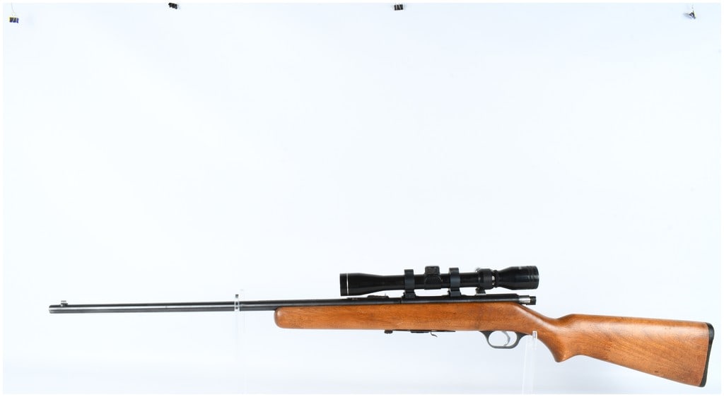 SPRINGFIELD J. Stevens Arms Company Model 84C Bolt Action Rifle .22 S L LR: This is a Springfield J. Stevens Arms Company Model 84C bolt-action rifle chambered for .22 Short, Long, or Long Rifle ammunition. The rifle features a blued finish and is mounted in a medium-toned ha