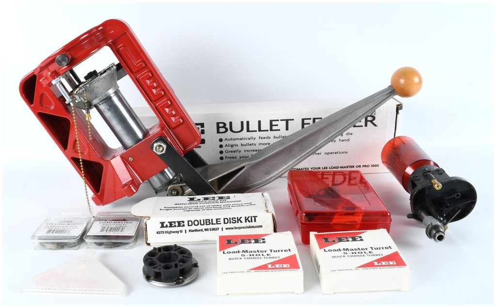 A Collection of 11 Lee Precision Load-Master Progressive Reloading Tools and Accessories: A Collection of 11 Lee Precision Load-Master Progressive Reloading Tools and Accessories. This lot consists of a comprehensive set of components designed for the Lee Load-Master progressive reloading