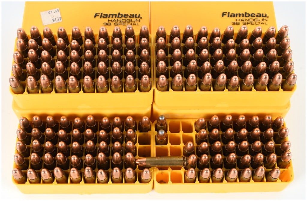 A Lot of 184 Mixed Ammunition Cartridges in Flambeau Handgun .38 Special Storage Containers: This lot consists of 184 cartridges of mixed ammunition, housed within four yellow Flambeau plastic storage containers. The containers are clearly marked "Flambeau HANDGUN 38 SPECIAL" and are designed