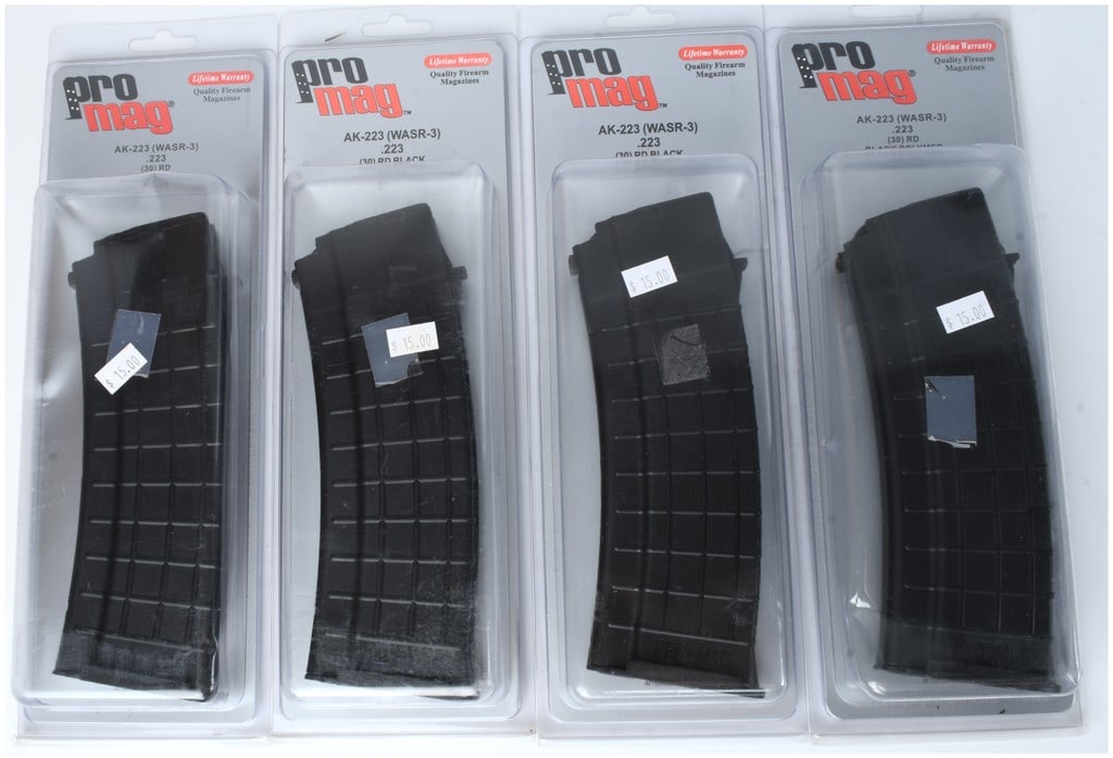 A Group of Four Pro Mag AK-223 (WASR-3) 30-Round Detachable Magazines, .223 Caliber: A collection of four Pro Mag AK-223 (WASR-3) detachable box magazines. These are curved, heavily ribbed black polymer magazines designed for AK-pattern rifles chambered in .223 Remington/5.56mm NATO,
