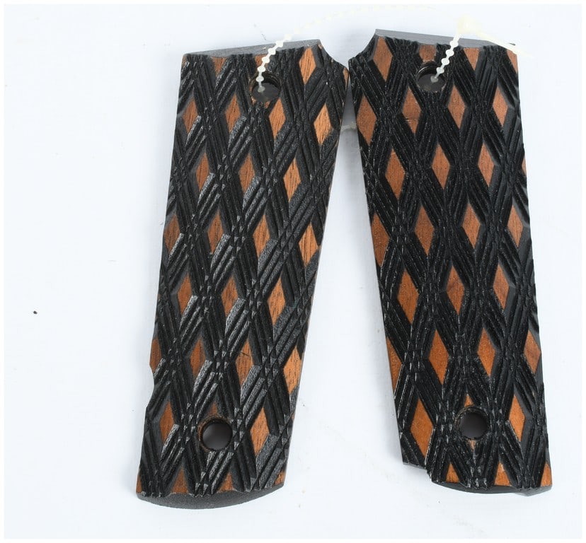 A Pair of Herrett's D-45 Skip Line Checkered Walnut Grips for Colt 1911 Pistols: A Pair of Herrett's D-45 Skip Line Checkered Walnut Grips for Colt 1911 Pistols. These grips are designed for the full-size M1911 pattern semi-automatic pistol, consistent with models manufactured by 