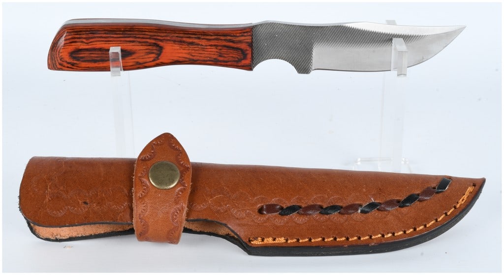 A Fixed Blade Knife with Serrated Spine and Custom Leather Sheath (1 of 6)