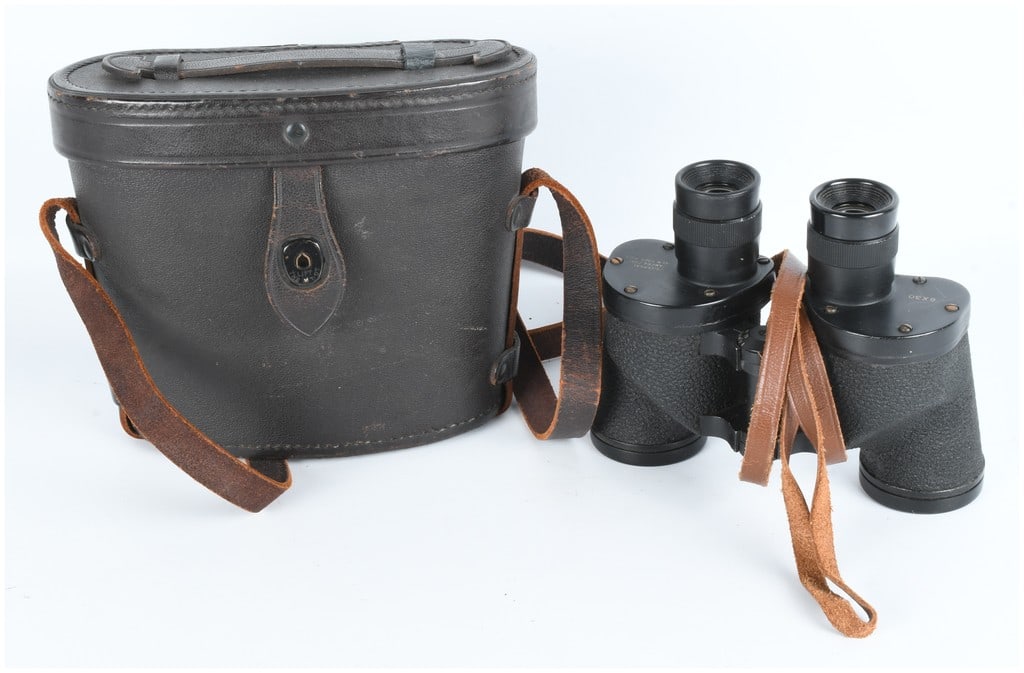 WWII Era U.S. Military 6X30 Binoculars by Universal Camera Corp. with Case: A pair of WWII era U.S. Military style 6X30 Porro prism binoculars manufactured by Universal Camera Corp. The binoculars feature black metal construction with a textured body covering and individual e