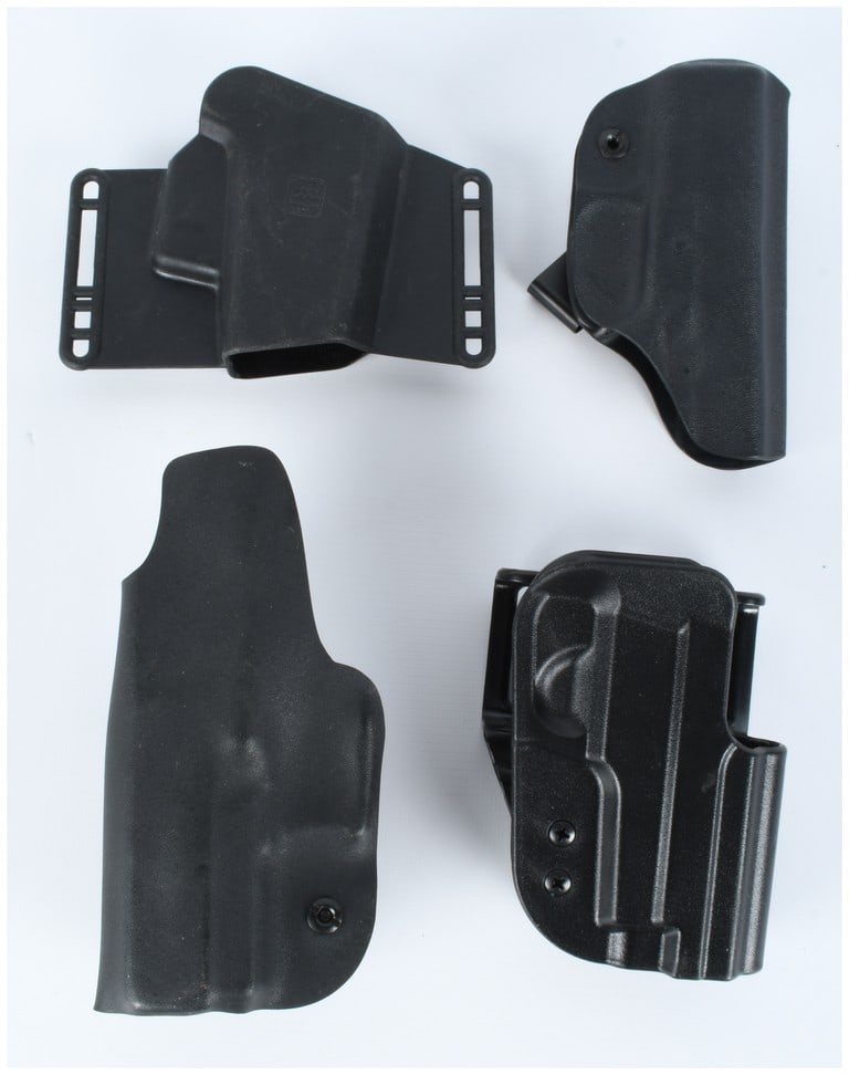 A Collection of 4 Polymer Handgun Holsters including Glock and Uncle Mike's: This lot consists of a collection of 4 polymer handgun holsters designed for concealed and open carry applications. The collection includes various styles, such as Outside-the-Waistband (OWB) and Insi