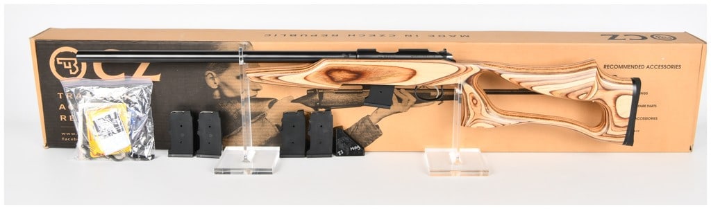 CZ 455 Varmint Evolution Bolt Action Rifle CAL .17 HMR (BBL 20.5) Serial C562087: A modern CZ 455 Varmint Evolution bolt action rifle chambered in CAL .17 HMR. The rifle features a heavy profile barrel and receiver finished in matte black/blued steel. The rifle is mounted in a dist