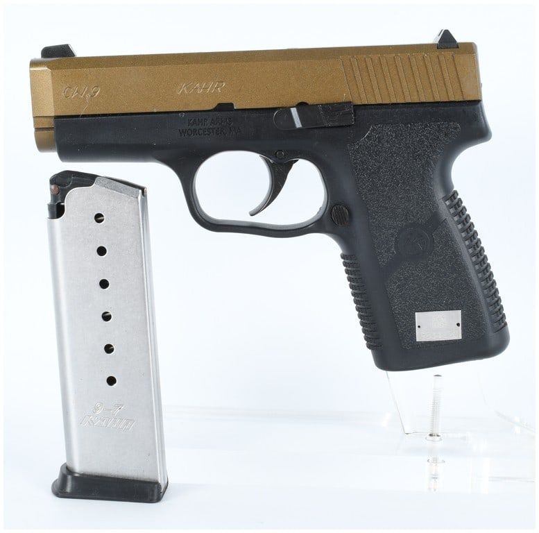 Kahr Arms CW9 Semi-Automatic Pistol in 9x19mm Serial Number G034120: This is a single semi-automatic pistol manufactured by Kahr Arms, identified as the CW9 model. The pistol features a black textured polymer frame and a contrasting burnt bronze finished slide, consist