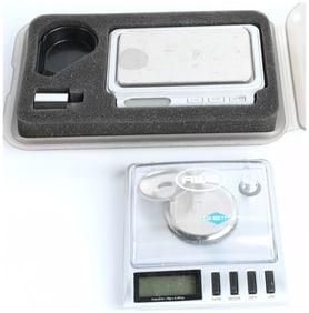 A Collection of 2 Digital Pocket Scales and Accessories