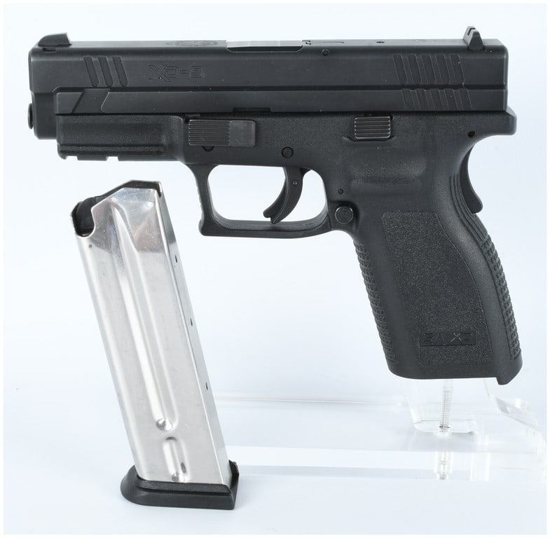 Springfield Armory XD-9 Semi-Automatic Pistol 9x19mm HD906956: A single Springfield Armory Model XD-9 semi-automatic pistol, chambered in 9x19mm (9mm Luger). The firearm is identified by the serial number HD906956, which is stamped on the visible portion of the b