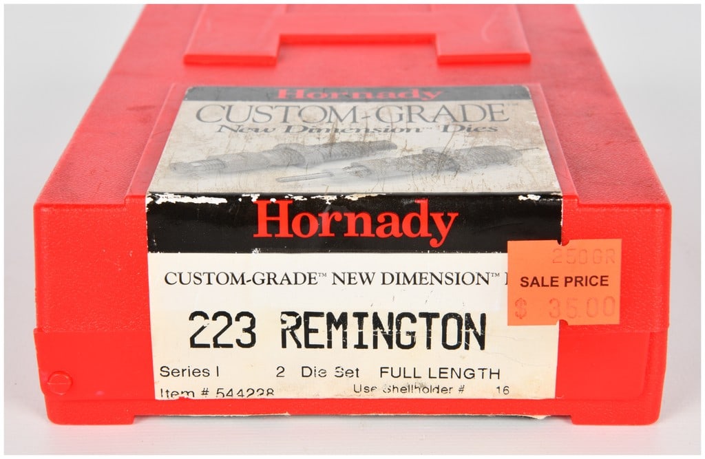 Hornady Custom-Grade New Dimension Series I 2 Die Set .223 Remington: This lot consists of a Hornady Custom-Grade New Dimension Series I Full Length 2 Die Set, designed for the .223 Remington caliber. The set is housed in its original red hinged plastic case. The two