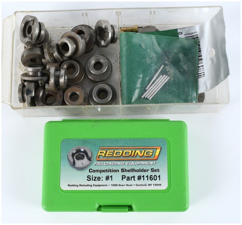 A Collection of 19 Reloading Shellholders and Accessories including Redding Competition Set: This lot comprises a collection of 19 metallic shellholders and various reloading accessories suitable for single-stage and turret presses, sourced from multiple manufacturers including RCBS, Lee,
