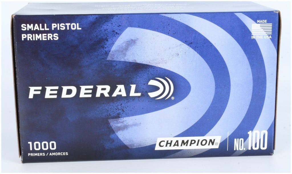 1000 Federal Champion No. 100 Small Pistol Primers: A collection of 1000 Federal Champion No. 100 small pistol primers. The lot consists of metallic cylindrical primers organized in plastic trays and housed within original blue and white branded cardbo