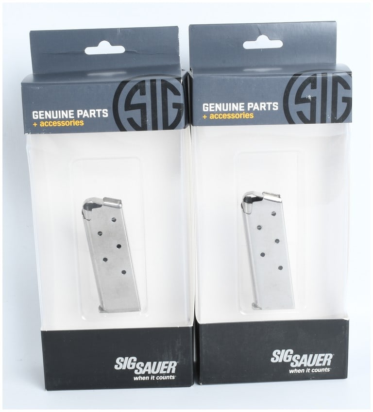 A Pair of Sig Sauer P238 6-Round Magazines: A pair of Sig Sauer P238 magazines chambered in .380 ACP. Each magazine is constructed from stainless steel and features a six-round capacity. The magazine bodies are designed with six witness holes f