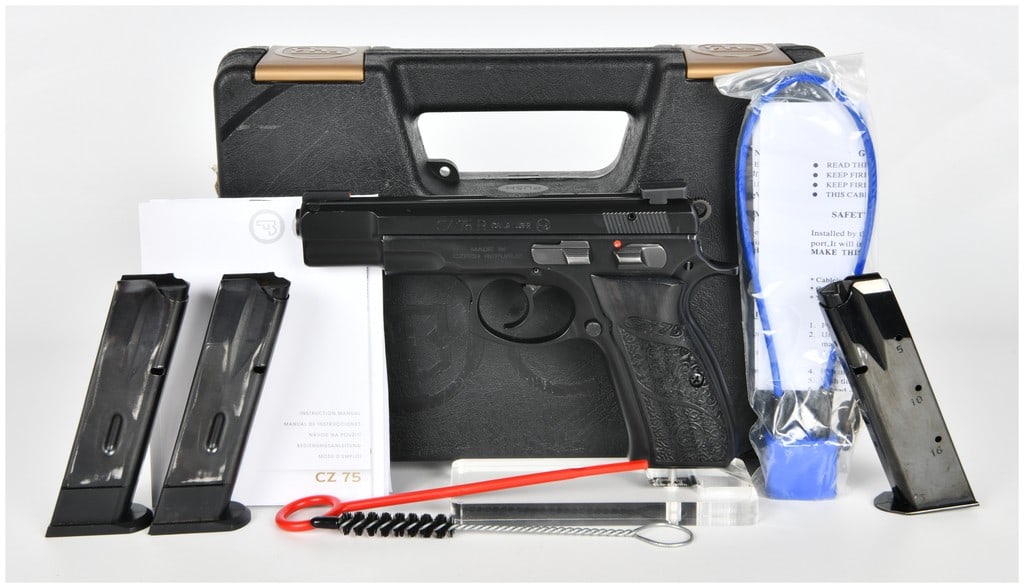 CZ, CZ 75 B Semi-Automatic Pistol, Custom Engraved Grips and Three Magazines, Circa 2017: This lot features a CZ 75 B semi-automatic pistol chambered in 9mm Luger. The firearm is finished in a durable black polycoat and is uniquely fitted with custom-engraved black grips showcasing intrica