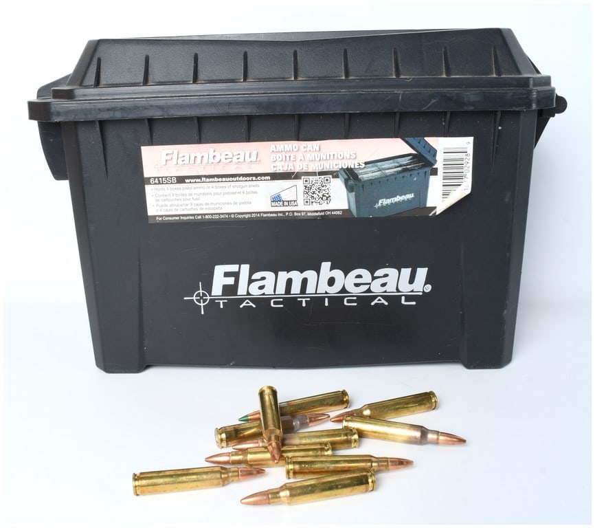 Flambeau Tactical Ammo Can Model 6415SB Filled with .223/5.56 Ammunition, Circa 2014: A large lot consisting of a modern, heavy-duty ammunition storage container manufactured by Flambeau Tactical, model 6415SB. The container is constructed of black molded polymer and is branded Flambea