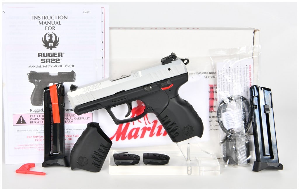 Ruger SR22 Semi-Automatic Pistol with Silver Anodized Slide and Original Packaging, c. 2014-Present: This is a Ruger SR22 semi-automatic pistol, specifically the SR22P model, chambered in .22 LR caliber. The firearm features a silver anodized aluminum slide with forward and rear cocking serrations an