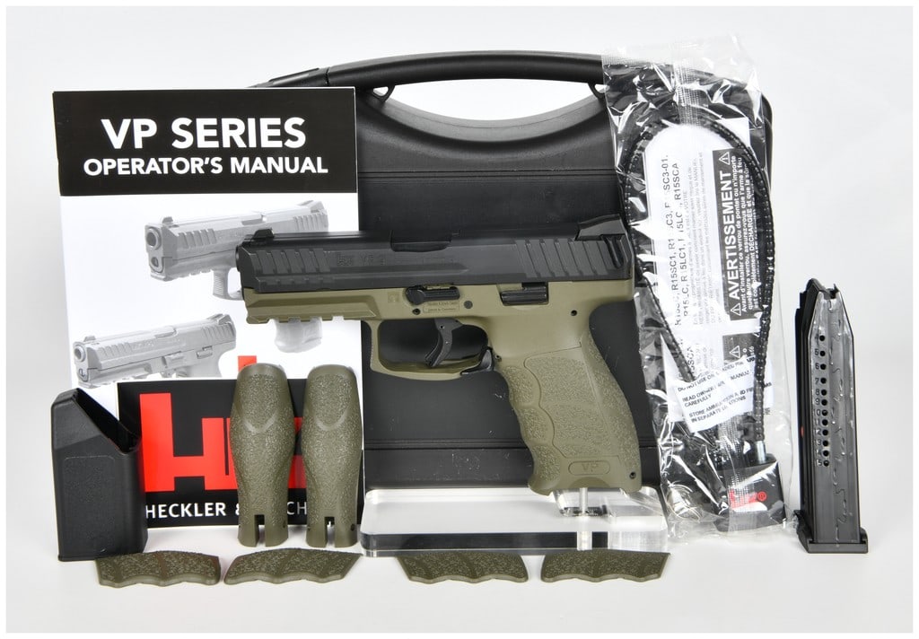 Heckler and Koch VP9 Semi-Automatic Pistol in NATO Green, 2017: This is a Heckler and Koch (HK) VP9 striker-fired semi-automatic pistol chambered in 9mm x 19. The firearm features a NATO Green polymer frame paired with a black steel slide. The slide is equipped wi
