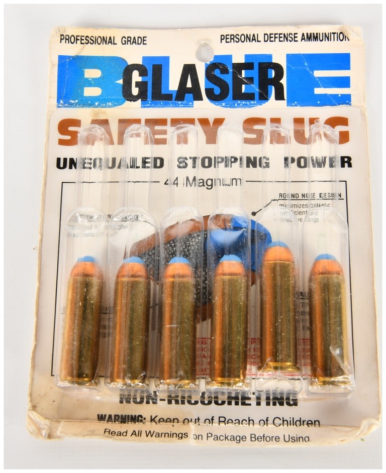 A Collection of Glaser Safety Slug .44 Magnum Ammunition: A collection of Glaser Safety Slug .44 Magnum personal defense ammunition presented in original vintage blister-style packaging. The cartridges are constructed with brass casings featuring R-P 44 REM
