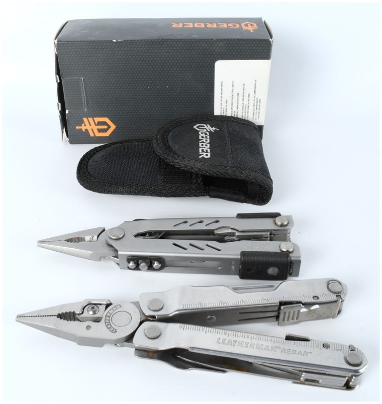 Gerber MP400 Compact Sport and Leatherman Rebar Stainless Multi-Tool Lot, c. 2000-2015: A two-piece lot of premium American-designed stainless steel multi-tools. The first tool is a Gerber Multi-Plier 400 Compact Sport (MP400), marked GERBER U.S.A. on the frame, featuring silver-tone