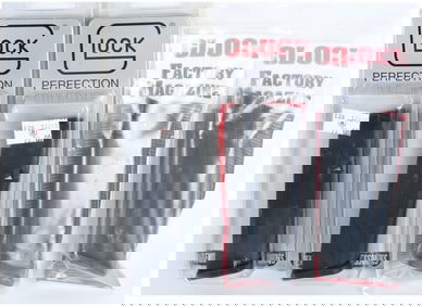 A Group of 4 Glock Factory Magazines