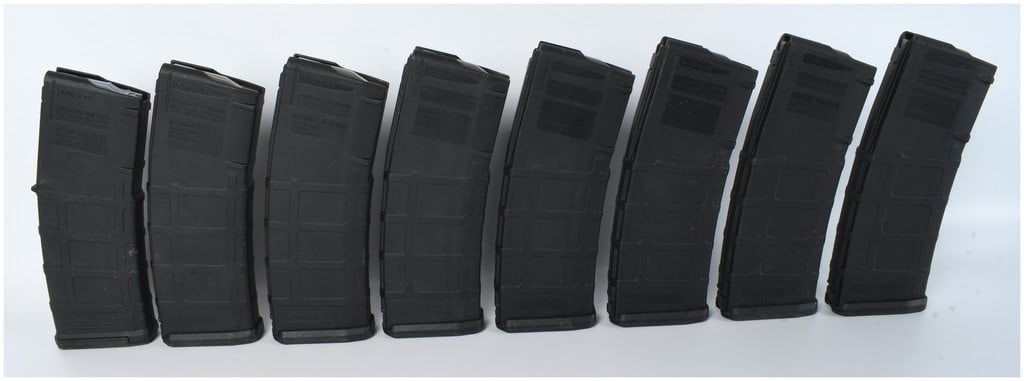 Eight Magpul PMAG 30 AR/M4 MOE Gen M2 Magazines: A group of eight Magpul PMAG 30 AR/M4 MOE Gen M2 magazines. These items are constructed from black textured polymer and are designed for 5.56x45mm NATO ammunition. The magazine bodies feature a curved
