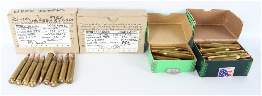 75 Rounds of .25-06 Reloaded Ammunition: A collection of 75 rounds of .25-06 caliber reloaded ammunition featuring brass casings and copper-jacketed soft-point bullets. The cartridges are accompanied by various cardboard and reinforced stora