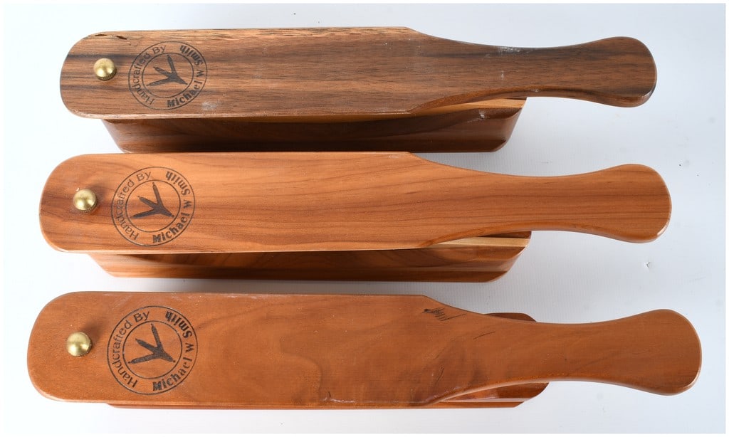 Michael W. Smith Handcrafted Turkey Box Calls, Mixed Wood Set of Three: This lot consists of three custom-made wooden friction box turkey calls, handcrafted by Michael W. Smith. Each call is designed to produce realistic turkey vocalizations (yelps, clucks, and cuts) thro