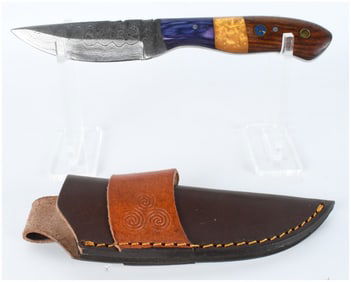 A Custom Damascus Steel Fixed-Blade Knife with Segmented Handle and Leather Sheath