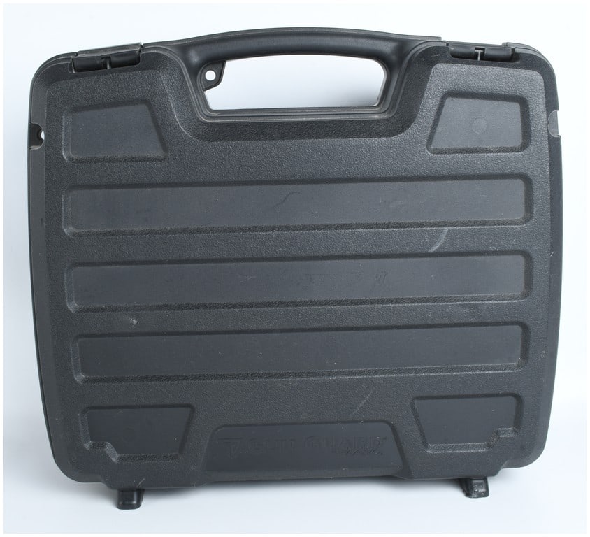 Plano Gun Guard SE Four Pistol Case: A Plano Gun Guard SE series four-pistol case. The unit is constructed from black molded plastic featuring a textured finish and horizontal reinforcing ridges on the exterior panels. It is designed wit