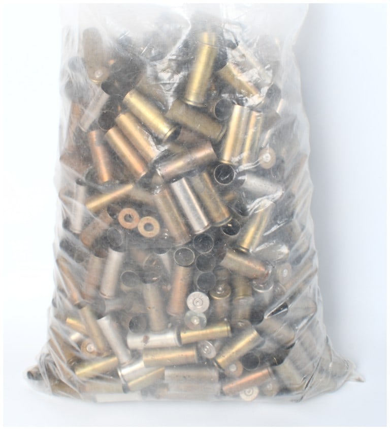 Mixed Lot of Reclaimed Empty Brass and Nickel Ammunition Casings, Including .44 Rem Mag: A substantial collection of spent ammunition components, confirmed by the consignor to include .44 Remington Magnum empty brass casings. The lot is presented in two groups: a large, uncounted bulk