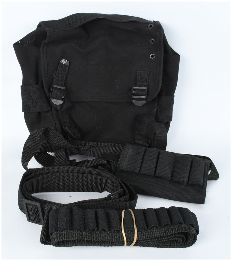 A Collection of Black Tactical and Utility Gear Including a Military Style Butt Pack: A collection of black tactical and utility gear. The group includes a heavy-duty black canvas butt pack featuring a flap closure secured by two adjustable nylon straps with plastic buckles and metal
