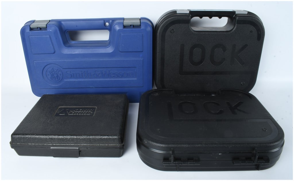 A Collection of Smith & Wesson, Glock, and Kahr Arms Handgun Cases: A collection of molded plastic handgun carrying cases from several manufacturers. The group includes a blue Smith & Wesson hard-shell case with a factory label for a Model 66-8 .357 Magnum revolver,