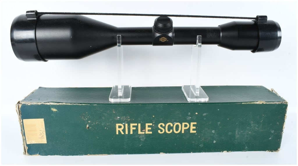 Ruko 8x56 Waterproof Rifle Scope with Original Box: This Ruko rifle scope is a fixed power optic featuring 8x magnification and a 56mm objective lens. The unit is constructed with a matte black metal body and is marked with the Ruko brand name and