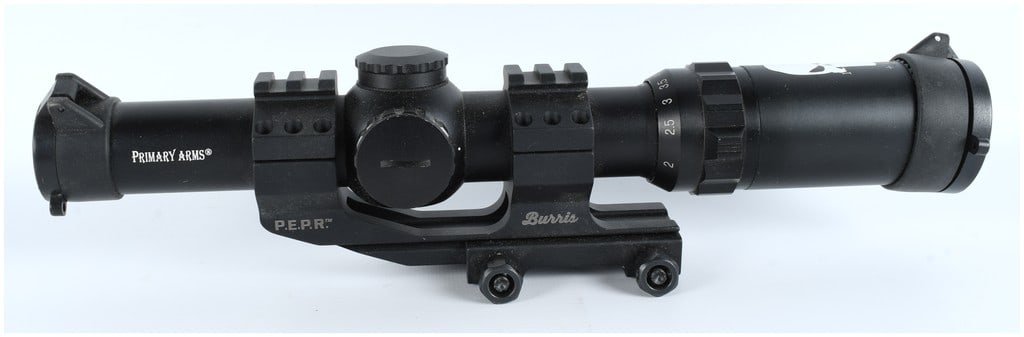 Primary Arms 1-4x24mm Low Power Variable Optic Rifle Scope with Burris P.E.P.R. Mount: A used variable power rifle scope manufactured by Primary Arms, mounted on a Burris P.E.P.R. cantilever mount. The scope body is constructed of black-anodized metal. Markings on the scope body include