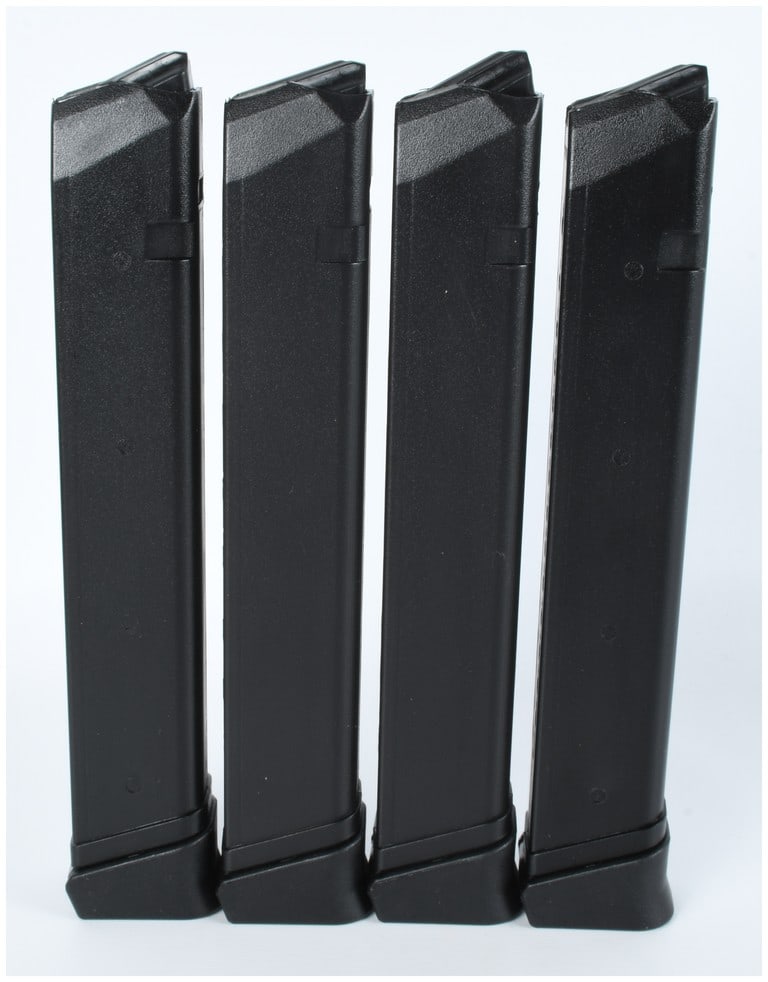 Four RWB 33-Round 9mm Magazines for Glock-Style Firearms: A group of four extended handgun magazines manufactured by RWB. These magazines are constructed from black polymer and are designed for use with 9mm Glock-style firearms. Each unit features a