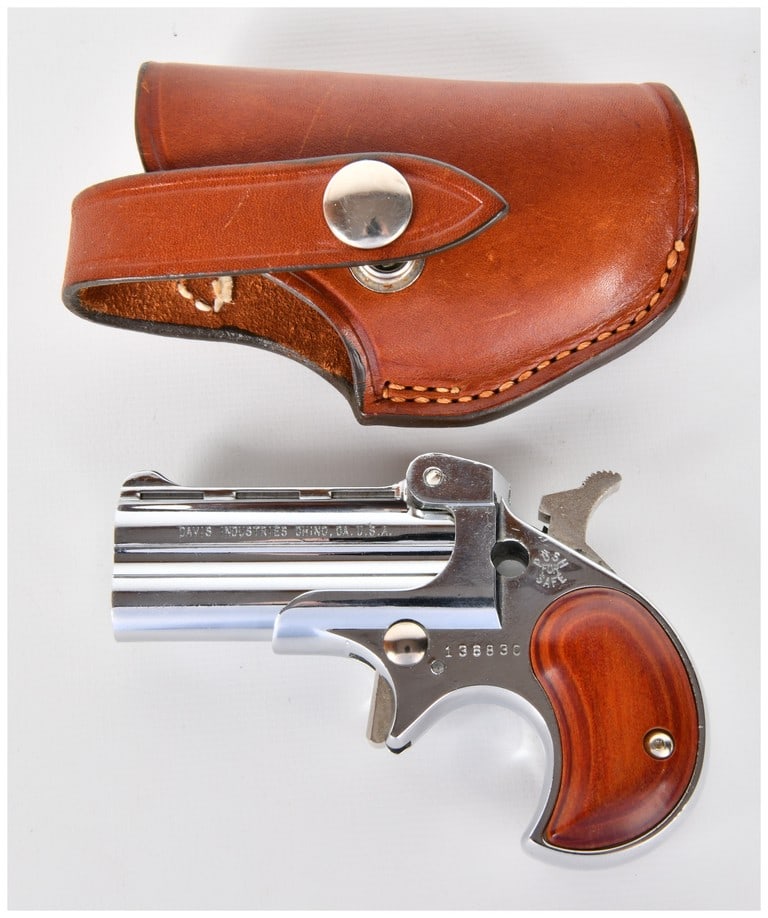 Davis Industries DM-22 .22 Magnum Derringer Pistol with Bucheimer Holster, Late 20th Century: A two-piece lot featuring a Davis Industries Model DM-22 double-barrel derringer pistol chambered in .22 Magnum, paired with a fitted Bucheimer leather holster. The firearm exhibits a highly polished