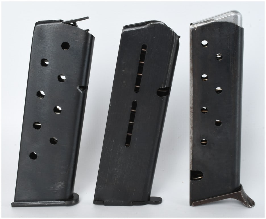 Three Semi-Automatic Pistol Magazines Including Beretta and ProMag Examples: A group of three semi-automatic handgun magazines constructed from blued steel, suitable for 9mm or .380 ACP caliber pistols. The collection includes one magazine featuring multiple round witness